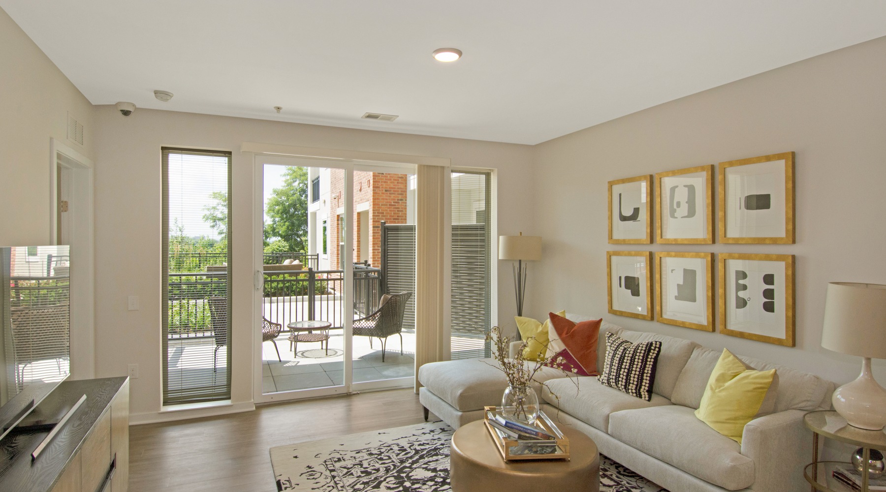Liberty Bay Club brightly lit social space with fireplace and wall mounted tv