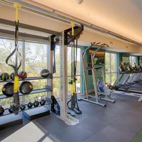 Strength and cardio center Strength and cardio center in fitness center surrounded by floor-to-ceiling windows